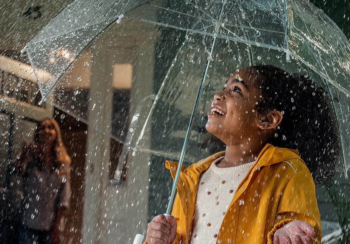 A mother reading her child a bedtime story on a tablet