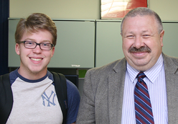  An executive and a teenager in a New York Yankees shirt