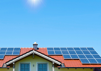 Solar panels on a red house roof