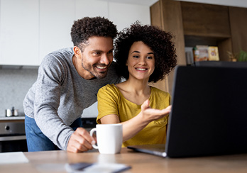 an older couple looking at a bill