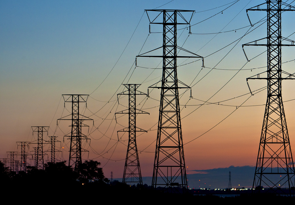 Power lines running through two metal towers