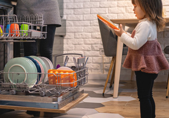 child at dishwasher