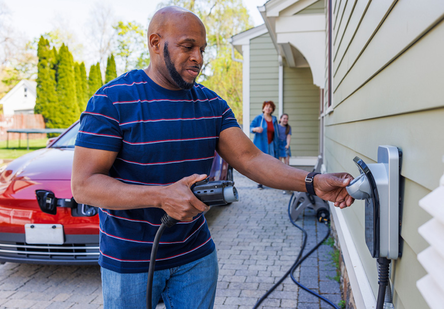 Man charging EV