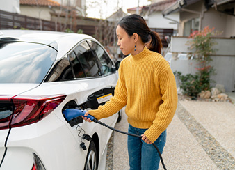 Women charging EV